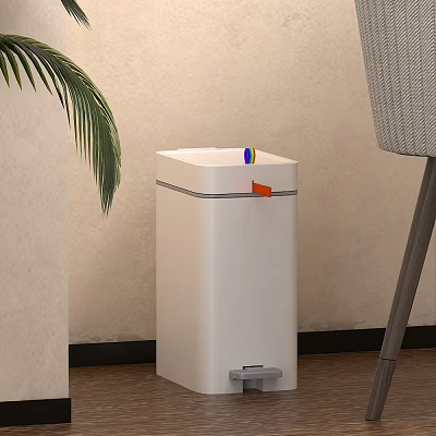 White Foot Operated Trash Can With Orange Button Near Plant And Chair 3d model