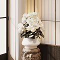 White Roses Arrangement In White Ceramic Vase On Stone Pedestal With Soft Natural Light