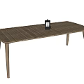 Wooden Dining Table With Slatted Top and Slim Legs Featuring Black Lantern Decoration