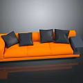 Modern Orange Sofa With Four Black Cushions And Small Square Gray Ottoman