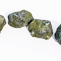 Natural Stones Covered With Green Moss Arranged In Curve On White Background