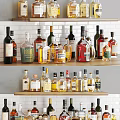 Various Wine Bottles And Glasses Arranged On Display Shelf With Different Labels And Colors