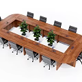Wooden Office Desk With Black Gray Office Chairs And Green Plants On Tabletop