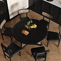 Modern Black Round Dining Table And Chairs With Beige Seat Cushions Sunflowers Bread Green Apples