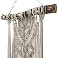 Cream Colored Macramé Wall Hanging With Wooden Stick And Tassels Design