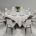 Modern Round Dining Table Set With White Tablecloth Green Plant And Eight White Chairs