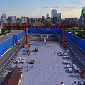 Road Infrastructure Construction at Urban Site With Red Crane Structure and Blue Barriers