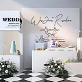 Wedding Dessert Table Setup With Cakes Flower Arrangements And Decorative Stands