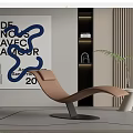 Tan Modern Lounge Chair In Contemporary Interior With Abstract Art And Green Plant