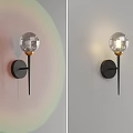 Modern Wall Light With Transparent Spherical Shade Black Base Gold Accent And Soft Lighting Effect