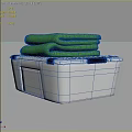 Transparent Plastic Storage Bin with Folded Blankets and Green Towels Inside