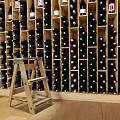 Modern Wooden Wine Cabinet With Multiple Wine Bottles And Ceiling Lights