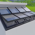 Residential Building Roof Featuring Multiple Glass Skylights With Black Frames Over Green Grass