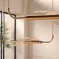 Modern Gold Curved Metal Chandelier With Mesh Shade In Interior Space With Plant