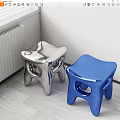 Shiny Modern Silver And Blue Stools In Indoor Corner With Light Floor