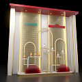 Luxurious Retail Window Display With Golden Arched Design Red Accents And Decorative Items