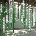 Art Installation Showcasing Tall Green Bamboo And Suspended Chinese Calligraphy Panels