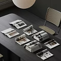 Arranged Open And Rolled Up Magazines On Dark Modern Table With Chair