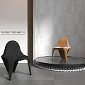 Stylish Black and Brown Leisure Chairs on Circular Platform With Gray Wall Background
