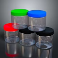 Transparent Plastic Jars With Different Colored Lids Stacked On Reflective Surface