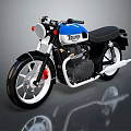 Triumph Vintage Motorcycle In Blue And White With Black Seat Round Headlight And Red Brake Caliper