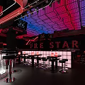 Modern Bar Interior With Red Blue Grid Ceiling DJ Booth Lighting And STAR Sign