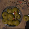Ceramic Bowl Filled with Yellow Apples on Wooden Table with Decorative Branches and Red Flowers