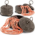 Vibrant Orange Beaded Necklaces With Black Dotted Jewelry Boxes And Intricate Details