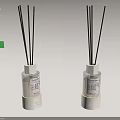 Two Scented Reed Diffusers with Black Sticks Transparent Bottles White Bases