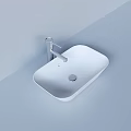 White Square Washbasin with Silver Faucet on Light Colored Wall and Countertop