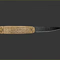 Decorative Knife With Golden Handle Intricate Carvings And Dark Blade On Reflective Surface