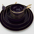 Elegant Multicolor Dinnerware Set with Stacked Plates Bowls and Gold Rim Spoons