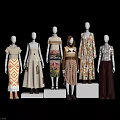 Multiple Fashion Models Showcasing Various Stylish Outfits On Display Stands 3d model
