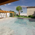 Modern Garden Landscape Featuring White Roof House Large Glass Windows Green Lawn And Trees