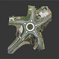 Aerial View Of Roundabout Intersection With Multiple Roads And Grass Areas