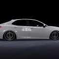 White Toyota Sedan With Modified Alloy Wheels And Sporty Exterior Look