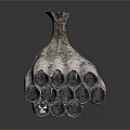 Artistic Silver Vase With Unique Tubular Structures And Textured Surface Design