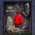 ARCTERYX Outdoor Themed Window Display With Red Jacket Backpack Rocks And Rope