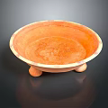 Orange Ceramic Bowl With Three Short Legs And Smooth Textured Surface 3d model