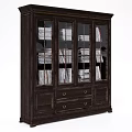 Dark Wooden Bookcase With Glass Doors Filled With Books And Drawers With Metal Handles