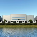 Modern Industrial Factory Building With White Exterior Large Windows Green Grass Waterfront And Blue Sky