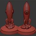Two Decorative Dark Rocket Figurines With Circular Base And Cloud Like Bottom Details 3d model