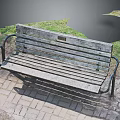 Natural Setting With Weathered Wooden Bench And Metal Armrests On Brick Pavement