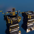 Ornate Black And Gold Landscape Sculptures With Square Structures And Top Emblem