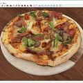 Freshly Baked Pizza Topped With Assorted Vegetables Meats And Creamy Melted Cheese