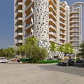 Modern Office Building With Perforated Facade Design And Lush Greenery Surrounding Parking Area
