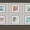 Six Framed Abstract Wall Art Pieces On Light Colored Wall With Herringbone Wood Floor