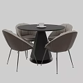 Modern Round Black Table With Four Light Gray Leather Chairs And White Cup
