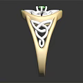 Exquisite Gold Ring With Green Gemstone And Intricate Metal Design
