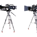 Two Professional Digital Cameras Mounted On Tripod Stands For Dual Recording Use